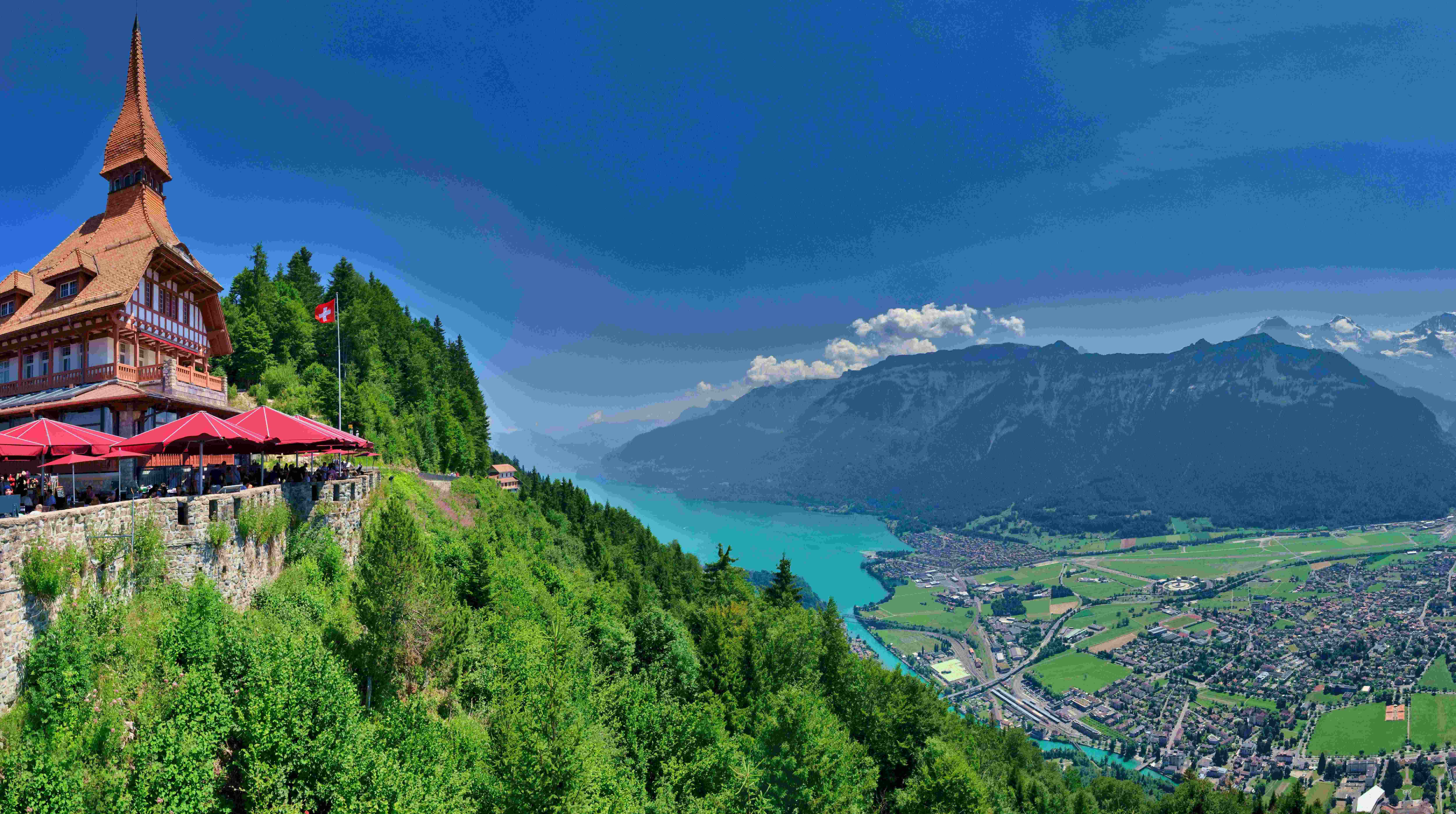 Things to Do in Interlaken: A Complete Guide to Switzerland's Alpine Playground<br />
Things to do in Interlaken span everything from cograilway journeys to the "Top of Europe" and gentle lake cruises to heart-pounding paragliding flights off a 1,300-metre cliff. Sitting on a narrow strip of land between Lake Thun and Lake Brienz, and framed by the peaks of the Eiger, Mönch, and Jungfrau, Interlaken has earned its reputation as one of the most scenic small towns in the Bernese Oberland. Whether you're planning a day trip from Zurich, Bern, or Geneva, or a slower multi-day stay, this guide walks through the attractions, excursions, and practical details that make Interlaken worth the visit — and how a private transfer can make getting there far more comfortable than the standard tourist route.<br />
Travelers arriving by train, car, or private chauffeur all land in the same compact town centre, but what they do next varies enormously depending on their pace, budget, and appetite for adventure. Some come purely for the mountain railways, others for the adrenaline sports the region is famous for, and many simply want a relaxed few days surrounded by turquoise lakes and snow-capped summits. This article breaks down the best things to do in Interlaken by category, so you can build an itinerary that fits your trip.<br />
Ride the Jungfraujoch Railway to the "Top of Europe"<br />
No list of things to do in Interlaken is complete without the Jungfraujoch excursion. Often marketed as the "Top of Europe," this cograilway journey climbs through tunnels cut directly into the Eiger and Mönch to reach Europe's highest railway station, at 3,454 metres above sea level. At the summit, visitors can walk through the Ice Palace, an underground network of sculpted ice tunnels, step outside onto the Sphinx observation terrace for panoramic glacier views, or look out across the Aletsch Glacier, the largest ice stream in the Alps.<br />
The trip typically starts in Interlaken and connects through Lauterbrunnen or Grindelwald before the final ascent aboard the Jungfrau Railway. Because of the altitude change and the popularity of the route, it's worth booking tickets in advance and dressing in layers even in summer, since temperatures at the top can sit well below freezing. Many visitors treat the Jungfraujoch as a full-day excursion on its own, leaving Interlaken early to beat the crowds and returning by late afternoon.<br />
Take in the View from Harder Kulm<br />
For a lower-effort but still spectacular alternative, the Harder Kulm funicular climbs directly from the edge of Interlaken to a viewpoint at 1,322 metres. The ride takes around ten minutes, and at the top a viewing platform known as the "Two-Lake Bridge" juts out over the valley, giving a wide-angle view of both Lake Thun and Lake Brienz at once, with the Eiger, Mönch, and Jungfrau lined up on the horizon. Because the funicular runs directly from town, Harder Kulm is one of the easiest things to do in Interlaken for travelers with limited time, and it pairs well with a meal at the restaurant near the summit before heading back down for the evening.<br />
Sunset and early-morning visits are particularly popular, since the light on the surrounding peaks changes quickly and the platform tends to be quieter outside of midday hours. It's a manageable half-day activity that doesn't require the planning or altitude adjustment that a Jungfraujoch trip does.<br />
Cruise Lake Thun and Lake Brienz<br />
Interlaken's name literally means "between the lakes," and a boat trip on either Lake Thun or Lake Brienz is one of the most relaxed things to do in Interlaken for those who want scenery without exertion. Lake Brienz is known for its striking turquoise colour, fed by glacial meltwater, and boats stop at lakeside villages like Iseltwald and Giessbach, home to a dramatic waterfall and a historic grand hotel. Lake Thun, on the other side of town, offers views of hillside castles, including Oberhofen and Spiez, and a slightly gentler, greener shoreline.<br />
Regular passenger ferries run seasonal timetables and can be combined with a rail pass for travelers using the Swiss Travel System. A full lake loop can take several hours, but shorter hops between towns are also available for those who want to sightsee from the water and then continue their day elsewhere in the region.<br />
Get an Adrenaline Fix: Paragliding, Canyoning, and More<br />
Interlaken has built an international reputation as a hub for adventure sports, and this is where the town separates itself from other Alpine destinations. Paragliding is the signature activity: tandem flights launch from Beatenberg or the Harder Kulm area and glide down over the town before landing near the River Aare, giving passengers an aerial view of both lakes in a single flight. No experience is required, and flights typically last between 15 and 25 minutes depending on conditions.<br />
Beyond paragliding, the region around Interlaken offers canyoning through the gorges near Lauterbrunnen, river rafting on the Lütschine, skydiving with views of the Jungfrau massif, and via ferrata routes on nearby cliffs. Winter turns the same terrain into a base for skiing and snowboarding at nearby resorts. For travelers weighing up things to do in Interlaken by thrill level, this is the category worth budgeting extra time and money for, since most operators require advance booking and are weather-dependent.<br />
Explore Trümmelbach Falls and the Lauterbrunnen Valley<br />
A short drive or train ride from Interlaken brings you to the Lauterbrunnen Valley, often described as one of the most dramatic valleys in Switzerland, with sheer rock walls and dozens of waterfalls cascading down from hanging glaciers. Trümmelbach Falls, a series of ten glacier-fed waterfalls flowing inside the mountain itself, is accessible via a lift and walkway system carved into the rock and is one of the more unusual natural attractions in the region.<br />
The valley is also the gateway to Wengen and Mürren, two car-free mountain villages reached by cable car and train, both offering close-up views of the Eiger's north face. Many visitors treat Lauterbrunnen and its surrounding waterfalls as a half-day trip from Interlaken, combining it with a stop at Staubbach Falls, which drops directly behind the village.<br />
Wander the Old Town and Höhematte Park<br />
Back in Interlaken itself, the town centre rewards a slower pace. Höhematte Park, the large open meadow in the middle of town, sits directly beneath the Jungfrau's silhouette and is a common landing zone for paragliders, making it a good spot to watch flights come in during the afternoon. Nearby, the Höheweg promenade connects the town's two historic train stations and is lined with hotels, cafés, and shops, including the grand Victoria-Jungfrau, one of Switzerland's most storied hotels.<br />
For a quieter walk, the Untere Gasse and the area around the Aare River offer a more local feel, with the bright turquoise river running straight through town. St. Beatus Caves, a network of limestone caves above Lake Thun with an underground waterfall, is another easy half-day option for travelers who want one more stop before heading back to their hotel or onward to the next town.<br />
Traveling to and Around Interlaken Comfortably<br />
Interlaken is well connected by Swiss rail, but many of the best excursions — Lauterbrunnen, St. Beatus Caves, the lakeside villages, or a direct transfer from Zurich or Geneva airport — are far more comfortable by private car than by juggling train connections and luggage. A private chauffeur service removes the guesswork around timetables and lets you set your own pace between the mountain railways, lake cruises, and adventure activities described above, which matters especially if you're covering several of these things to do in Interlaken within a single day. It's a detail worth considering when planning the trip, particularly for travelers arriving directly from an international airport or moving on to another Swiss destination afterward.<br />
In Short<br />
From the glacier views at Jungfraujoch to a quiet afternoon on Lake Brienz, the things to do in Interlaken cover an unusually wide range for a town this size — mountain railways, adventure sports, lake cruises, waterfalls, and an old town built around two of the country's most beautiful lakes. Planning around two or three main excursions per day, with a private transfer to handle the logistics between them, is generally enough to see the highlights without rushing. Whatever the pace, Interlaken remains one of the clearest examples of why the Bernese Oberland draws travelers back again and again.<br />
Frequently Asked Questions<br />
How many days do you need in Interlaken? Most travelers spend two to three days in Interlaken, which is enough time for a Jungfraujoch excursion, a lake cruise, and one or two shorter activities like Harder Kulm or the Lauterbrunnen waterfalls. A longer stay of four to five days allows time for adventure sports and day trips to nearby villages like Mürren or Wengen.<br />
Is Interlaken worth visiting if you're not into adventure sports? Yes. While Interlaken is known internationally for paragliding and canyoning, many of its best attractions — the lake cruises, Harder Kulm, the Old Town, and Jungfraujoch — require no special fitness or risk tolerance and appeal to a wide range of travelers.<br />
What is the best time of year for things to do in Interlaken? Summer (June to September) offers the fullest range of activities, including boat cruises and hiking, with the clearest mountain views. Winter turns the region into a ski base, while spring and autumn are quieter and offer lower prices, though some cable cars and trails may have reduced schedules.<br />
Do you need a car to see the main attractions in Interlaken? No — Interlaken and the surrounding valleys are well served by trains, funiculars, and boats. That said, a private transfer or chauffeur service is often more efficient for reaching sites like St. Beatus Caves or Lauterbrunnen without waiting on public transport schedules.<br />
How do you get from Zurich or Geneva to Interlaken? Interlaken is roughly two hours from Zurich and just under two and a half hours from Geneva by train, with direct or single-connection routes. Private transfers are also available for travelers who prefer door-to-door service, particularly after a long flight.<br />
Is the Jungfraujoch trip worth the cost? For most first-time visitors, yes — it's the only way to reach a station at this altitude in the Alps and includes access to the Ice Palace and glacier viewpoints. Travelers on a tighter budget can get comparable panoramic views for less by visiting Harder Kulm or Schilthorn instead.</p>
<p>SEO Title (57 chars): Things to Do in Interlaken: Amazing Alpine Adventures<br />
Meta Description (154 chars): Things to do in Interlaken range from Jungfraujoch train rides to lake cruises and paragliding — discover the best of the Swiss Alps.<br />
Focus Keyword: things to do in Interlaken<br />
