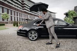 Chauffeur opening Luxury car door for Geneva Aiport to interlaken transfer